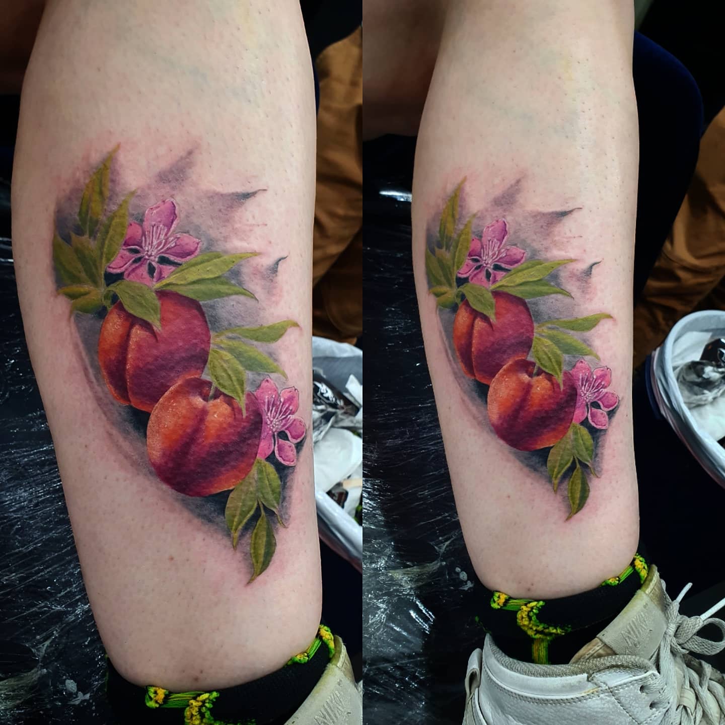 Colorful tattoo of peaches and pink flowers on a leg